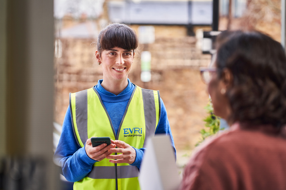 Female-courier-and-customer-at-doorstep-urban2